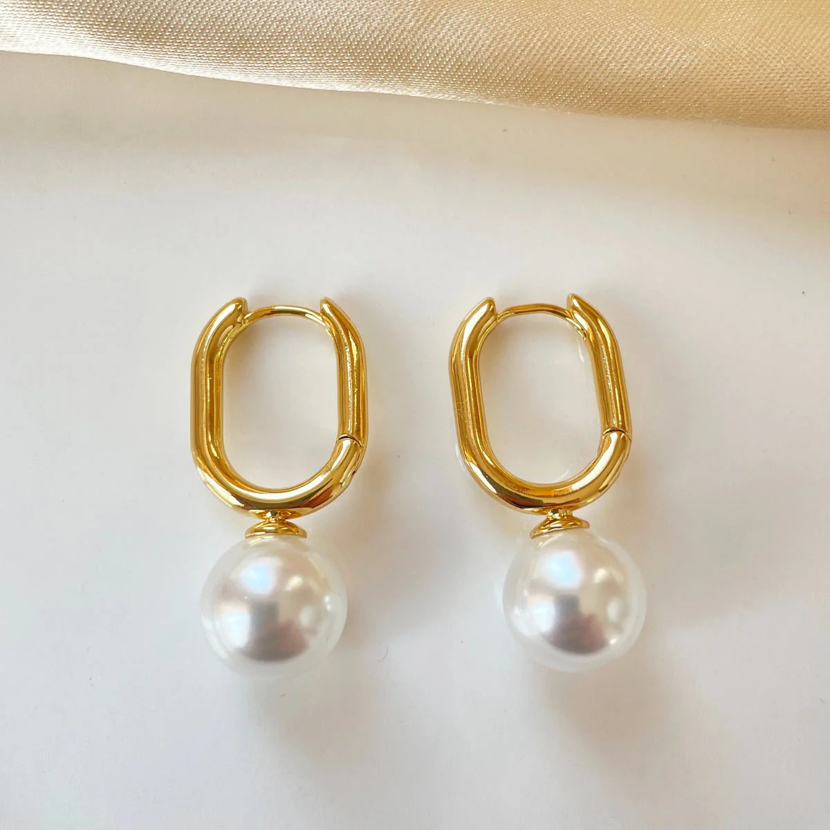 Oval Pearl Huggie Earrings